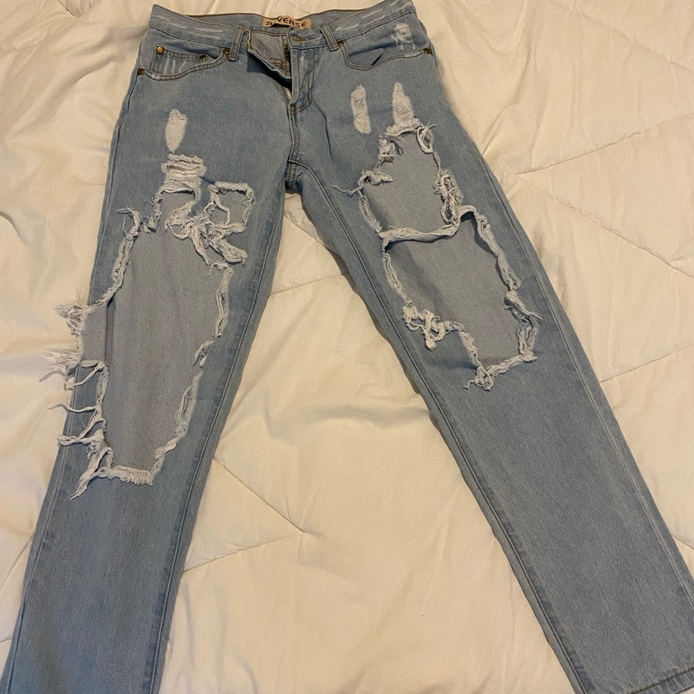 Reverse ripped blue jeans